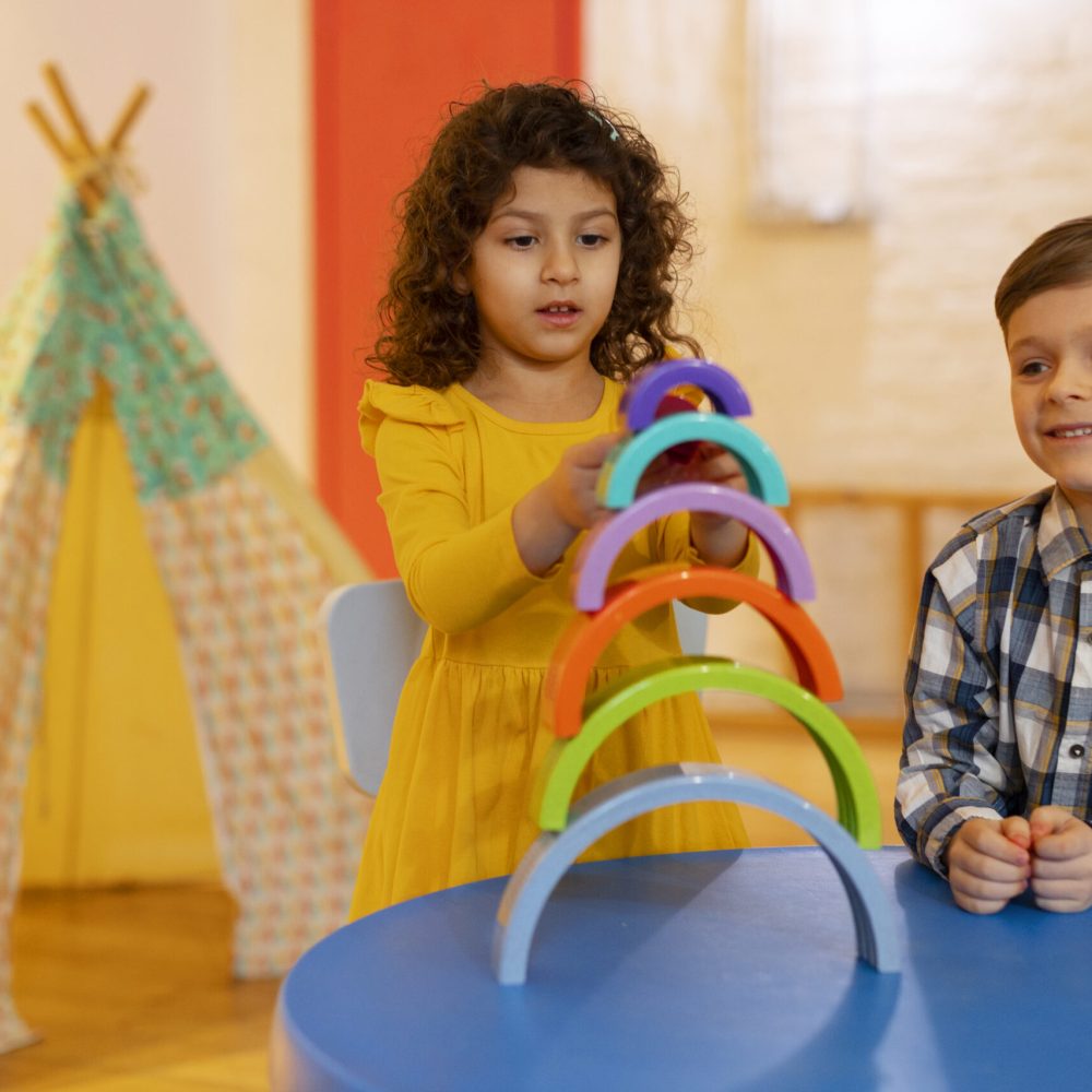 young-boy-girl-playing-indoors-with-eco-toys